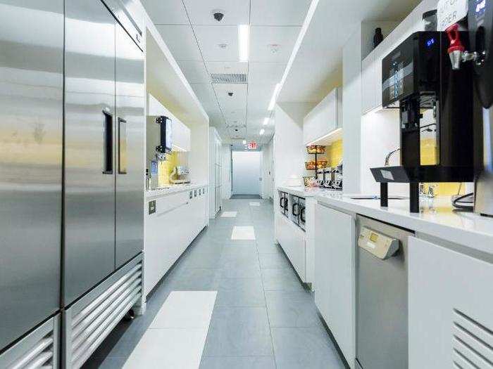 Each floor has its own kitchen that is situated in a hallway that runs through the center of the building.