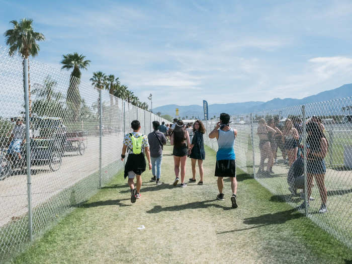 The shuttle drops festival-goers about a half-mile away from the entrance to the grounds. As soon as you step off the shuttle, you can feel the energy buzzing in the air. Attendees were jumping up and down and shouting in excitement as they walked — or maybe they just needed to pee.