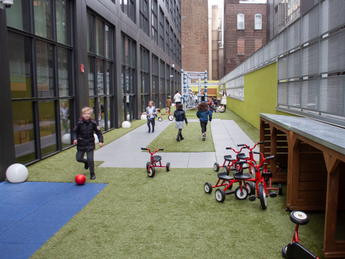 Outside was a spacious play area with tricycles, balls, and even mini-picnic tables.