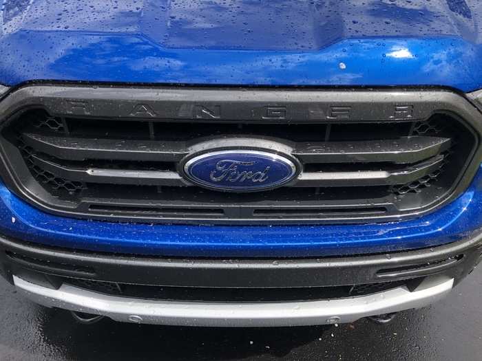 The Blue Oval and the Ranger nameplate share space on the blacked-out grille.