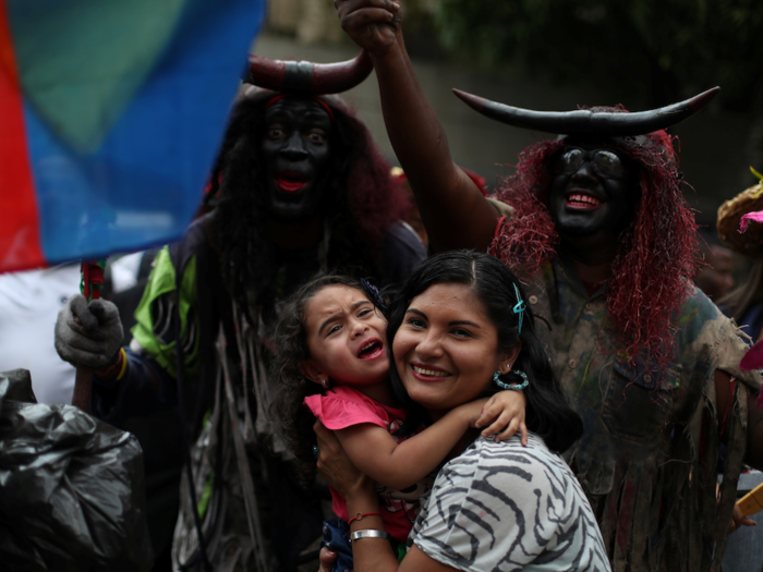 Parades and celebrations remain a draw for Venezuelans.