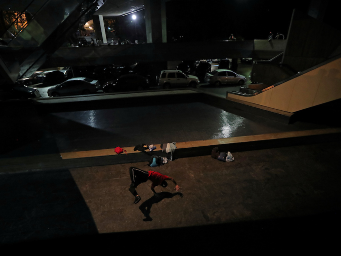 Break dancing is a popular escape. Yeafersonth Manrique, aka "B-Boy Chispa," practices at a theater.