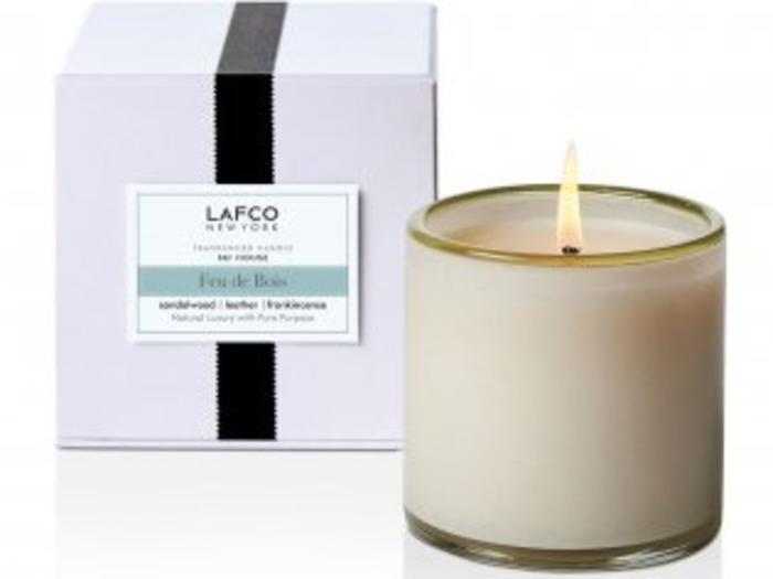 A luxe holiday candle that comes in a hand-blown glass container they can reuse