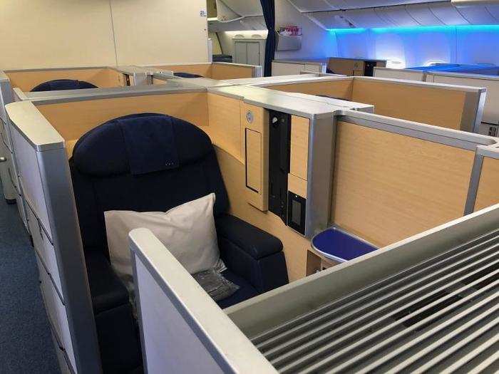 The seats are basically open "suites," large (by airplane standards) enclosed cubicles with an open door and ceiling.