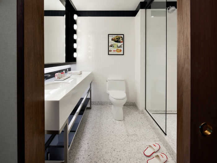 The "Hollywood-style" bathroom features bubble lights and subway tile.