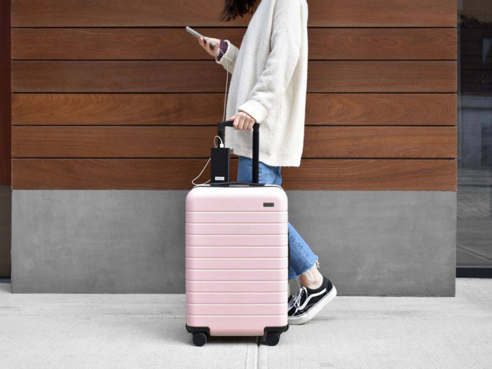 A suitcase with an ejectable battery that can charge their devices on the go