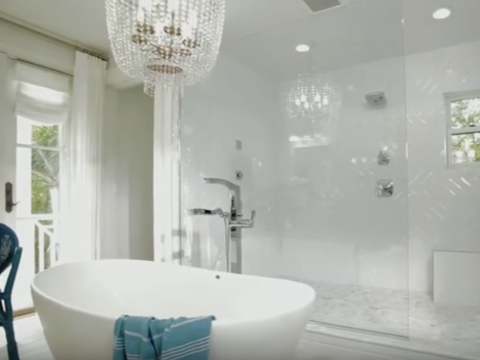 The master suite comes with a Roman tub and an impressive walk-in shower.