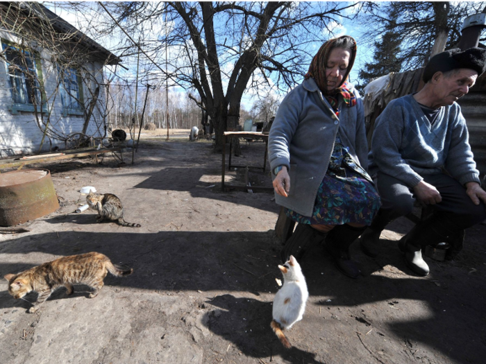 He said that life inside the exclusion zone is difficult, though he keeps himself busy by cooking for his chickens and chopping firewood.