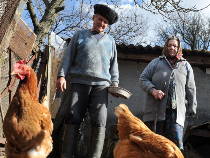 Semenyuk said that he returned to his village of Parishev, about eight miles from the nuclear power plant, two years after the explosion. He said that his wife Marya, pictured below, passed away in 2017.