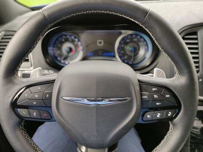 In front of the driver is a function-packed steering wheel complete with switches for the audio system, cruise control, and telephone. There are also a pair of paddle shifters and mystery buttons on the steering wheel. These mystery buttons are found throughout the FCA range and are simply supplemental audio switches.