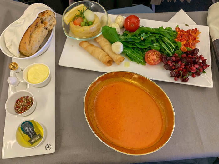 I got a glass of white wine, a selection of nuts, and a Turkish cheese puff pastry. After the crew offered up fresh bread baskets, I got a creamy roasted red pepper soup and got a few extra snacks from the trolley. I was almost full and I hadn