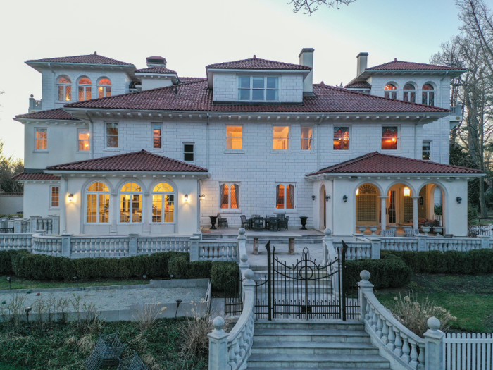 Outside, the mansion features an expansive deck ...