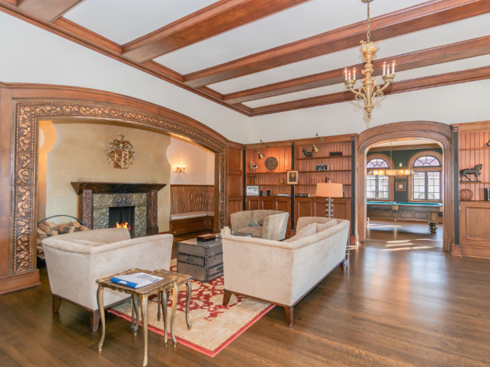 Another living room is decorated with wooden accents.