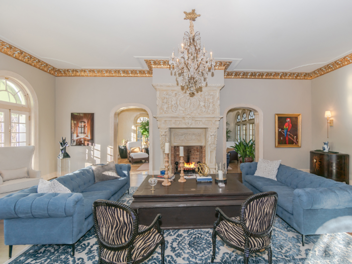 ... and a classic gold-gilded room updated with animal-print chairs. The entire home totals 24,000 square feet.