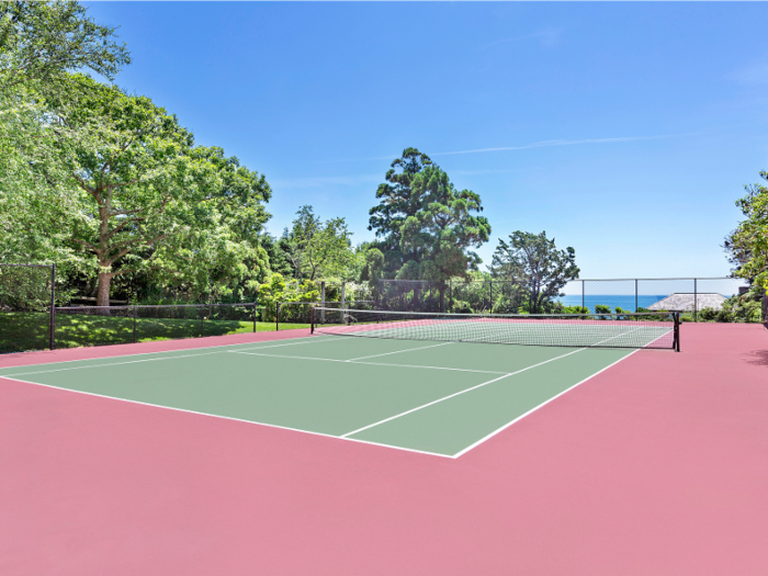 In addition to the 2,100-square-foot main house, the property includes a tennis court, a guest house, and a pool house.