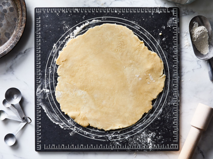 A multi-purpose cutting board designed for bakers