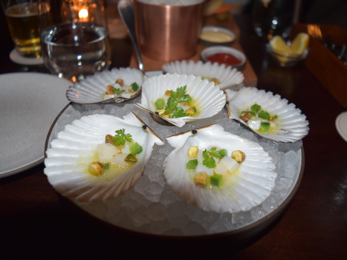 The menu was filled with exceptional food and dessert options, including some foods that are unusual to see at a typical bar. We ordered a round of the bay scallops marinated with yuzu and pistachio …