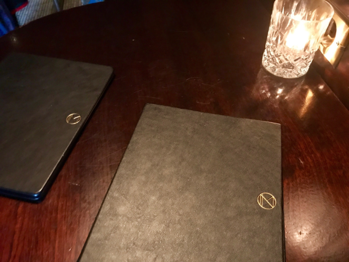  Every leather bar stool was taken already, so I squeezed myself at a standing bar a few feet away. A waiter came over to me and handed me a menu almost immediately, which was another pleasant surprise. 