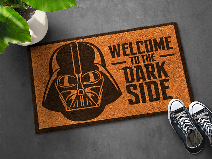 A doormat with a friendly welcome message