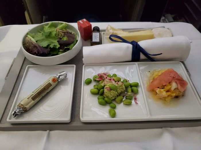 Lunch on the flight back was delicious. After an amuse bouche of a single scallop, we started with a salad, a pea puree, and shrimp tartare with mango. Everything was flavorful and paired nicely together.