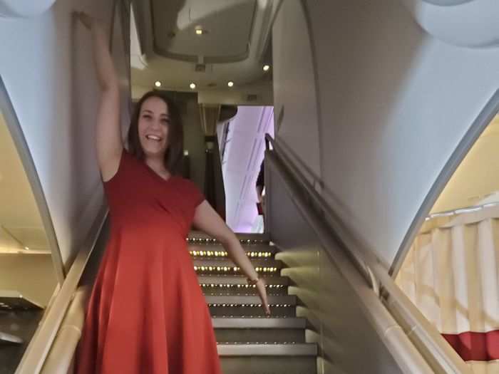 We asked one of the flight attendants where the stairs were, and she took me over to see them, then insisted on taking my picture. How fun!