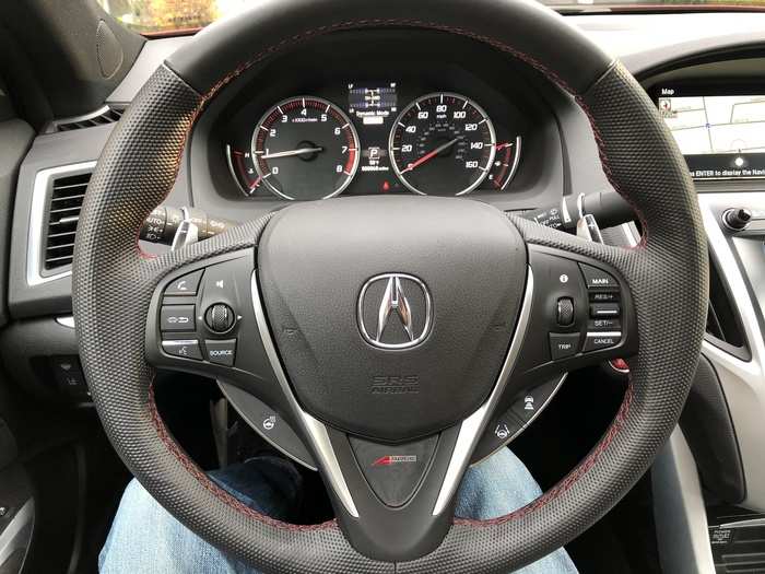 The leather-wrapped steering wheel gets some snazzy red topstitching and a tiny A-Spec logo. The numerous buttons and knobs enable the driver to operate the infotainment system without taking their hands off the wheel. The steering wheel is heated, and the instrument cluster is old-school analog.