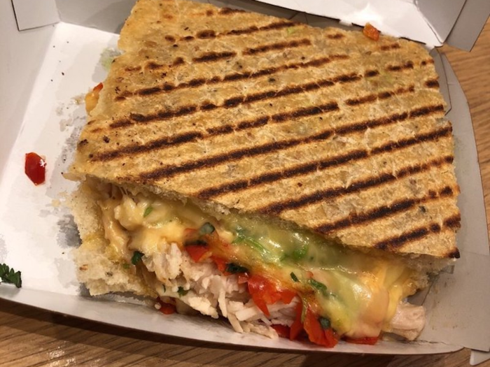 Sandwiches get heated up on a panini press, a process which one employee said typically takes two minutes.