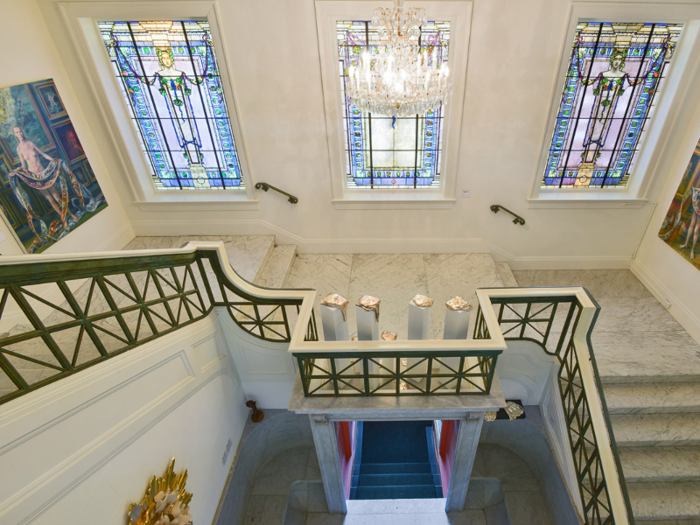 And encircling the atrium is a classic mansion staple: a grand central staircase.