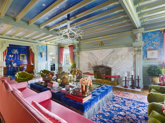 Its colorful setting boasts an original beamed ceiling and grand fireplace.