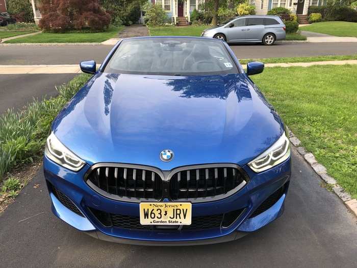 The signature BMW kidney grille is blacked-out and narrow, stretching from headlight to headlight.