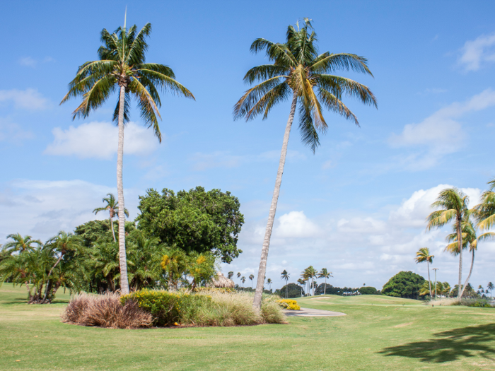 A pristine 18-hole golf course spans the center of the island.