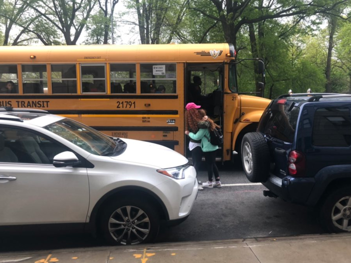 Prawda-Weiss and the girls wait for separate buses, which come near the edge of Central Park. Sometimes they continue to go over homework assignments before the bus comes. Other times she chats with moms who are also waiting for the bus.