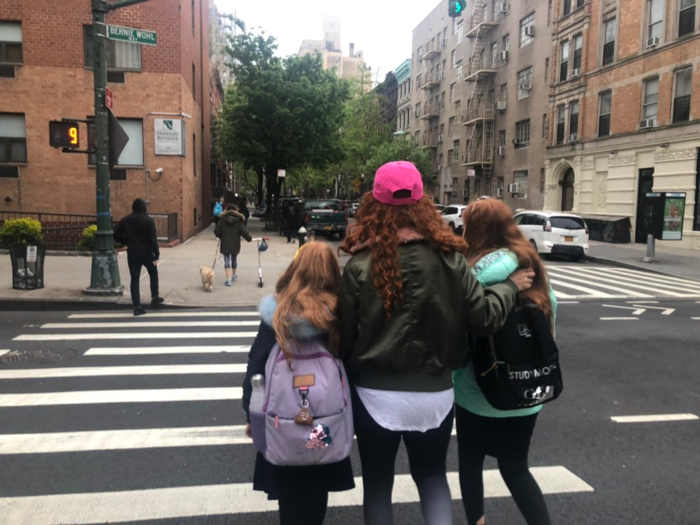 The mom walks her kids to the bus stop each morning. She and her husband don