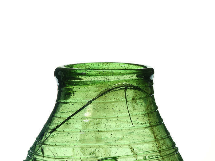 A decorated green glass beaker was excavated as well.