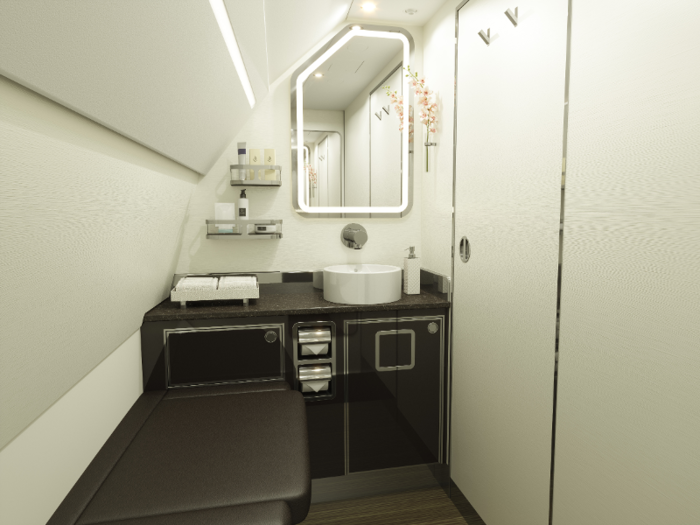 The new jet also features updated bathrooms, which are designed to look and feel like regular hotel restrooms. There are two bathrooms on the plane — along with one smaller crew bathroom — each with a full-length mirror and bench seating.