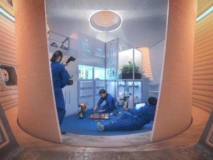 The pods feature hatches that deploy space suits and a docking port for a Mars Exploration Rover.