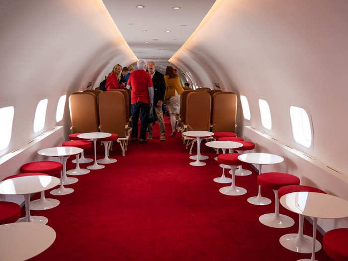 There are a few different seating options, including restored aircraft seats, and regular tables. According to a representative for Gerber Group, which operates the lounge, some of the furniture still needs to be installed ...