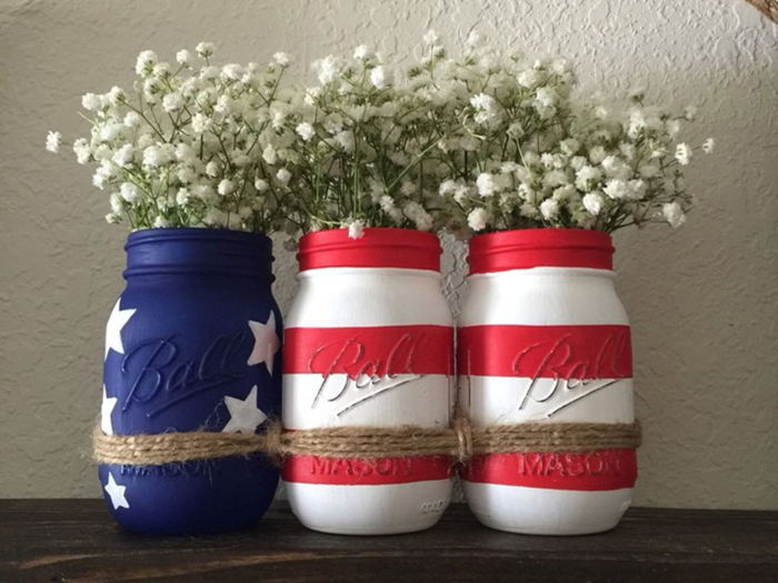 A set of hand-painted Mason jars