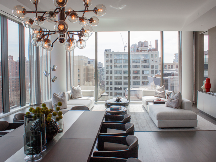 The expansive great room offers views of the Empire State Building and overlooks the High Line, the city