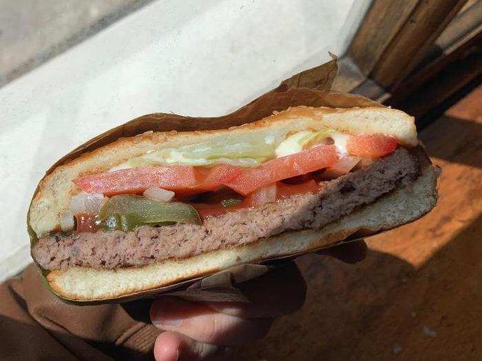 The patty has a slightly watery umami flavor, which is nicely cut by the pickles and onion.