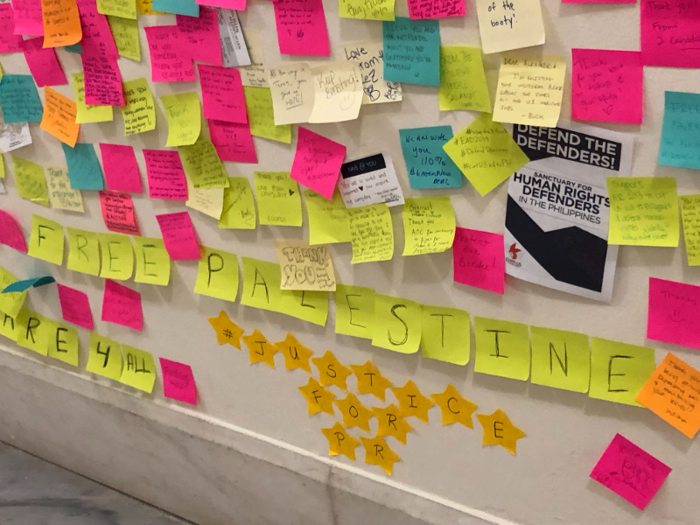 Some visitors will use multiple Post-Its to craft a large message, like "FREE PALESTINE."