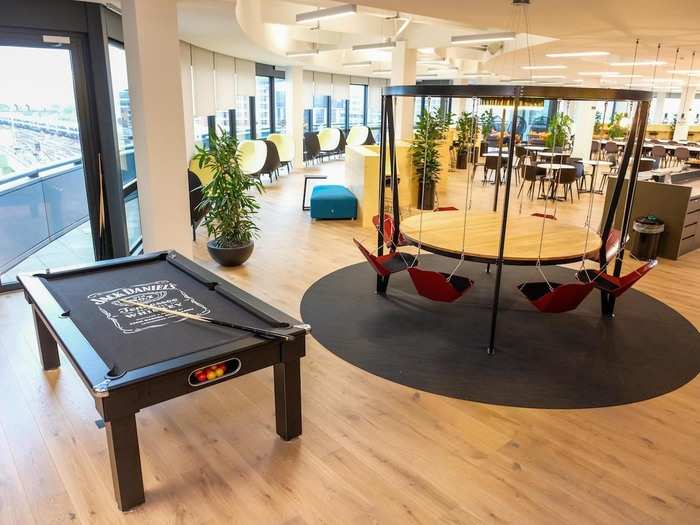 Employees can play pool and sit on swing-like chairs when they