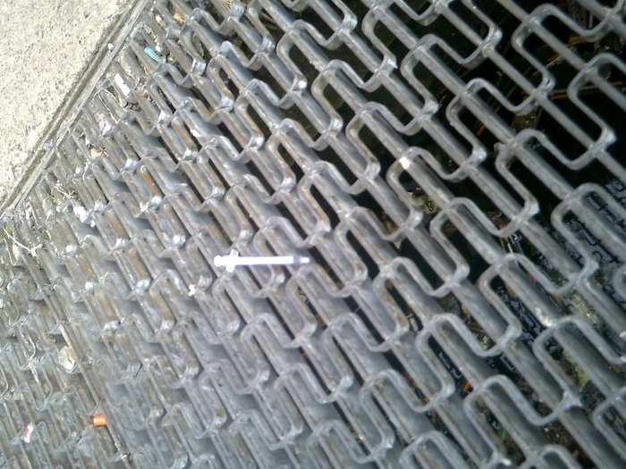 Another theme that came up a lot in the photos was drug use, Dafilou said. This picture shows used needles in a storm drain.