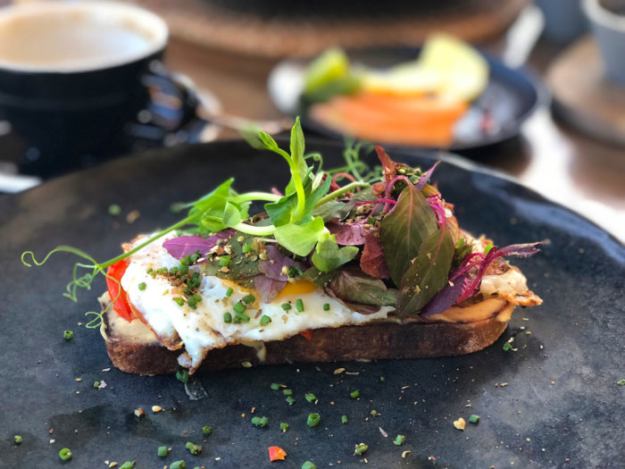 I decided to try out one of the menu items this time. While I watched the avocado toast go by for the person dining next to us, I thought hummus toast was more of a unique choice. Plus, it was seasoned with Za