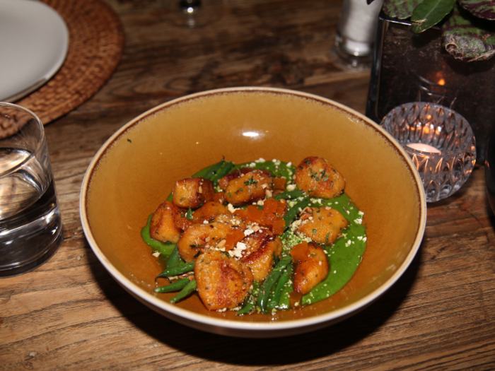 We ordered butternut squash gnocchi and an asparagus dish to start, main dishes of three different proteins including one with springbok — a classic South African game meat — and one dish called Cape Seafood Curry — the flavors were inspired by city