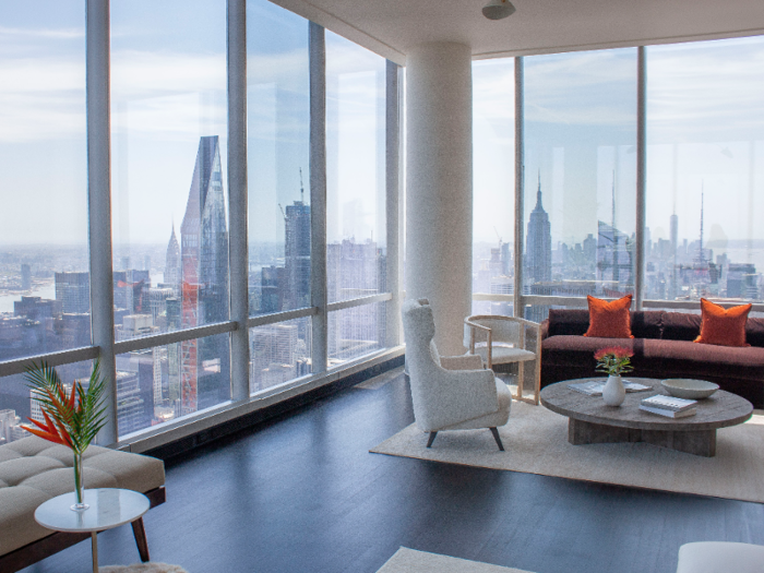 The wraparound floor-to-ceiling windows of the master bedroom offer views facing north, east, and south toward the Empire State Building.