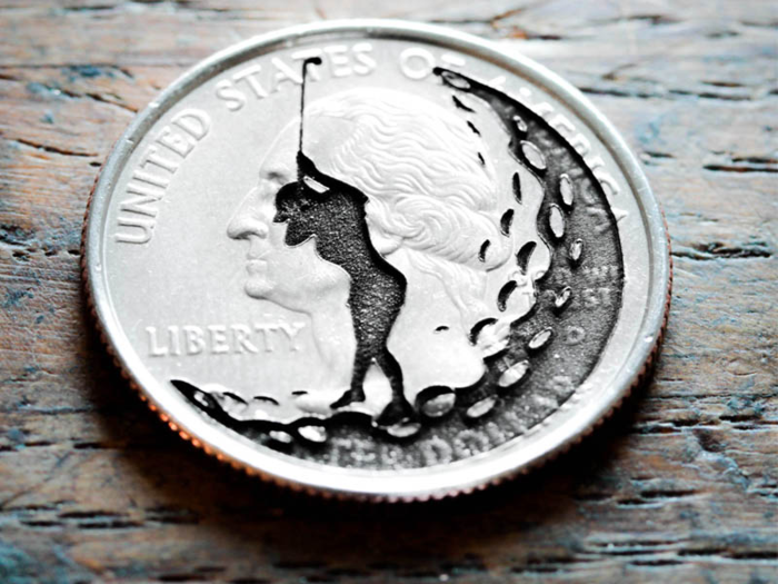 An engraved golf ball marker made from a real quarter