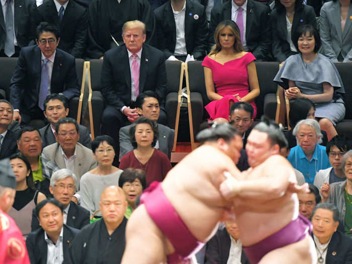 The leaders and first ladies later attended the Summer Grand Sumo Tournament in Tokyo on Sunday night.