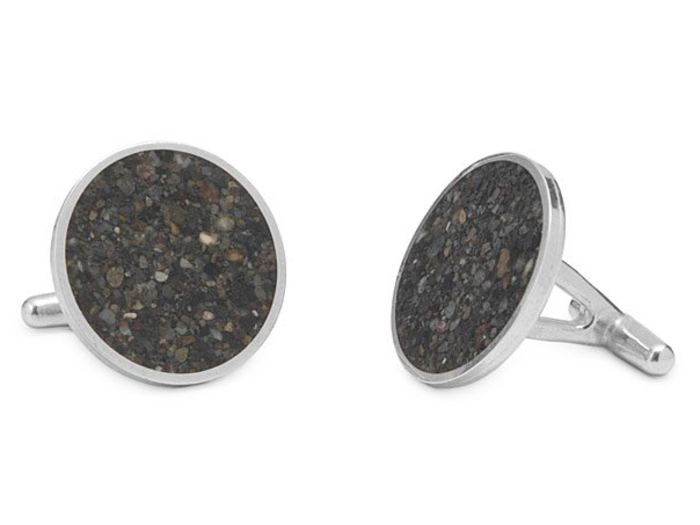 Cufflinks containing sand from his favorite beach