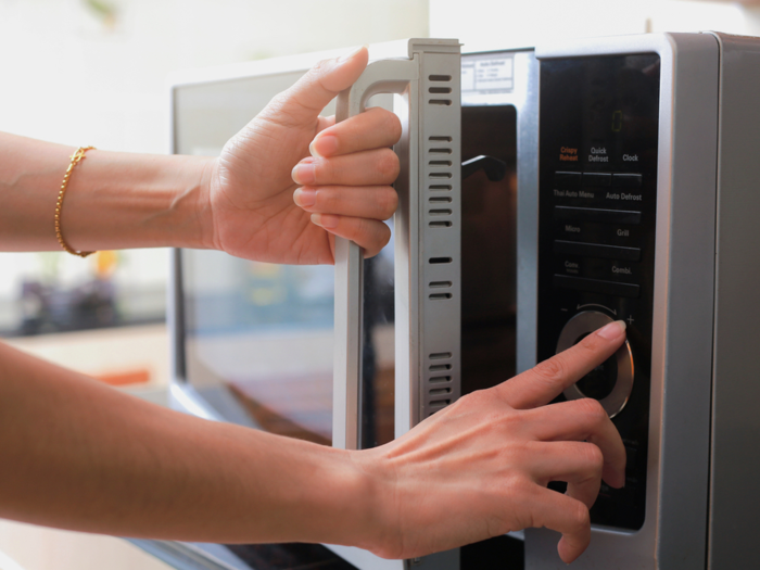 People in the US use microwave ovens to heat their water